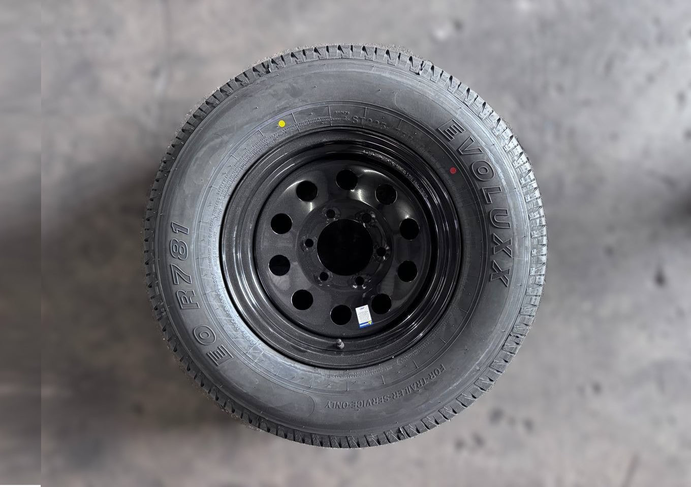 ST225/75R15 10-Ply Radial Trailer Tire On Black Mod Wheel 6 Lug